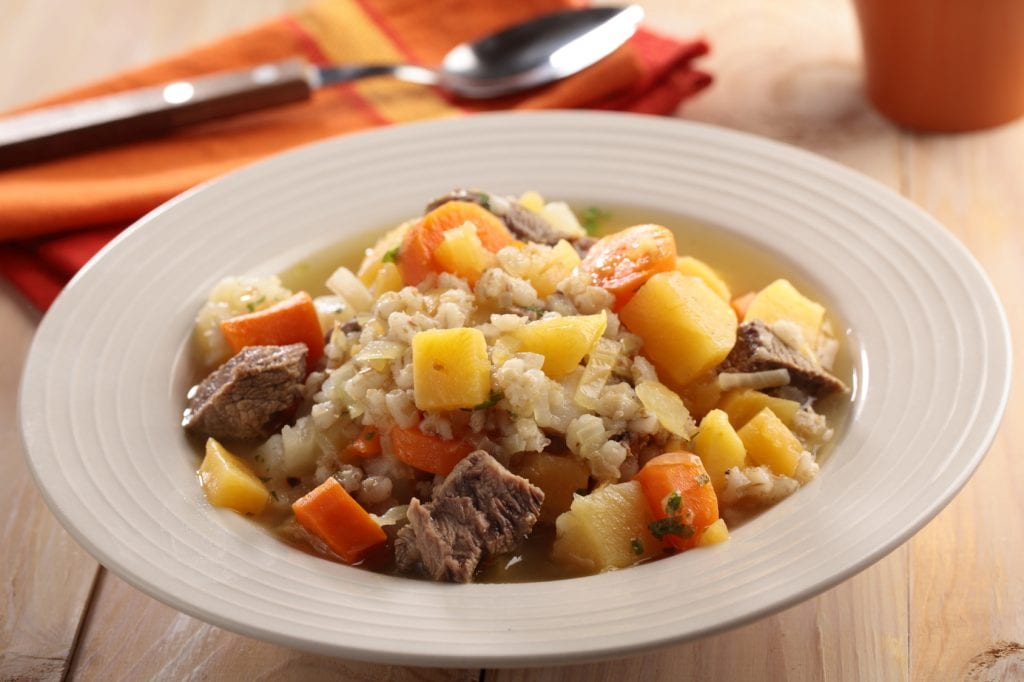 Irish coddle in a rustic bowl closeup